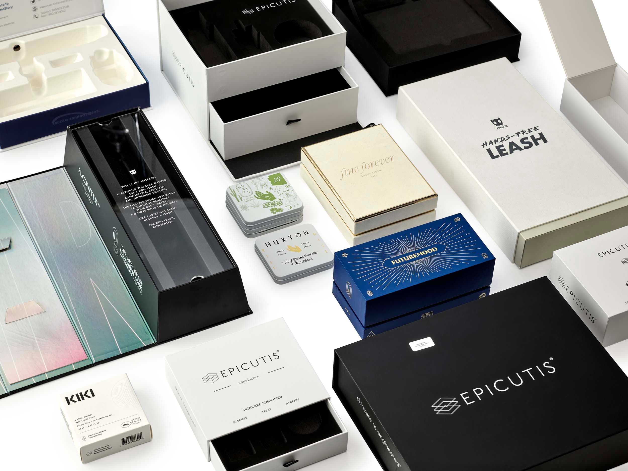 Multiple packaging formats and materials across beauty brands — glass, rigid boxes, folding cartons, and specialty finishes