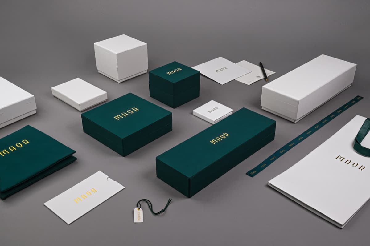 Custom jewelry packaging collection — multiple box sizes with consistent branding