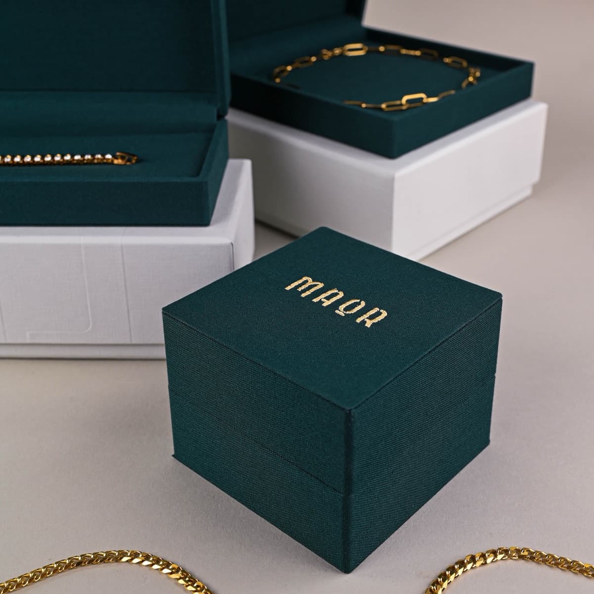 Custom jewelry boxes showing collection system with consistent materials and finishes