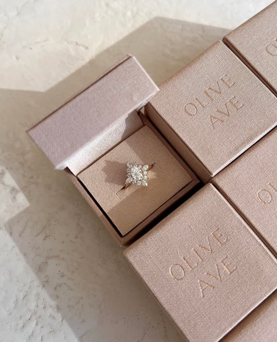 Olive Ave Jewelry — blush linen ring boxes with tone-on-tone embossed branding and hinged lid
